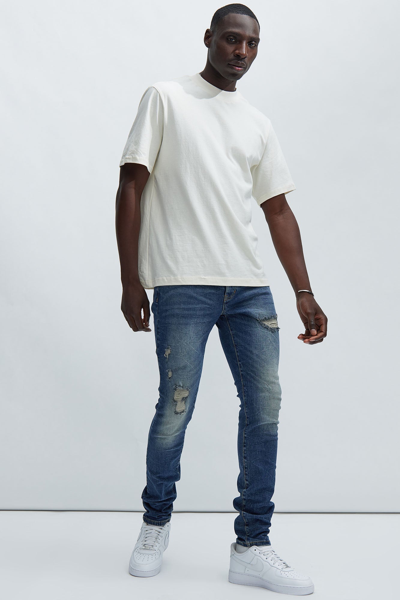 Primary Distressed Stacked Skinny Jeans - Dark Wash